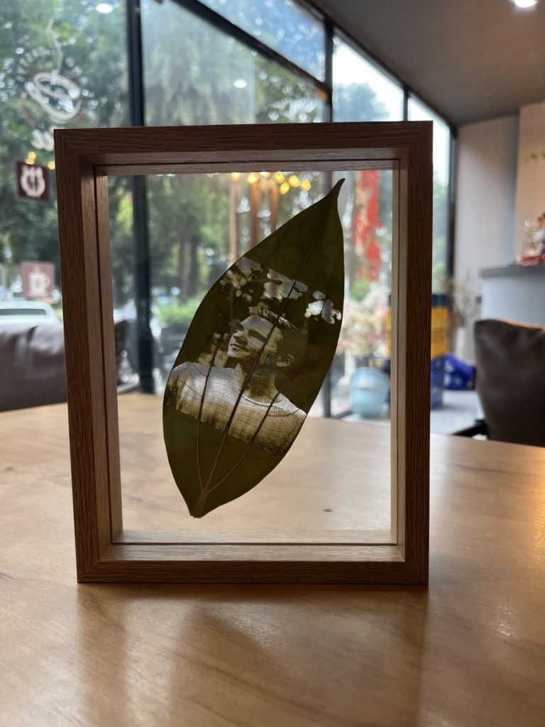 Standard walnut picture on leaf frame.