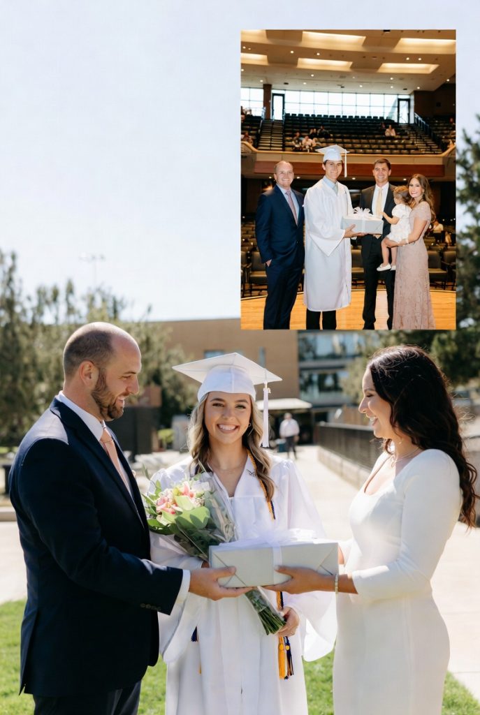 Smiling white male graduate in robe accepts gift from family in auditorium, celebrating milestone with heartfelt graduation present ideas.