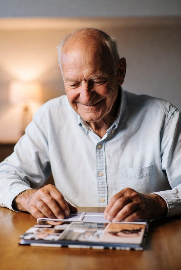 Older dad appreciating meaningful and personal gift – heartfelt Father's Day moment