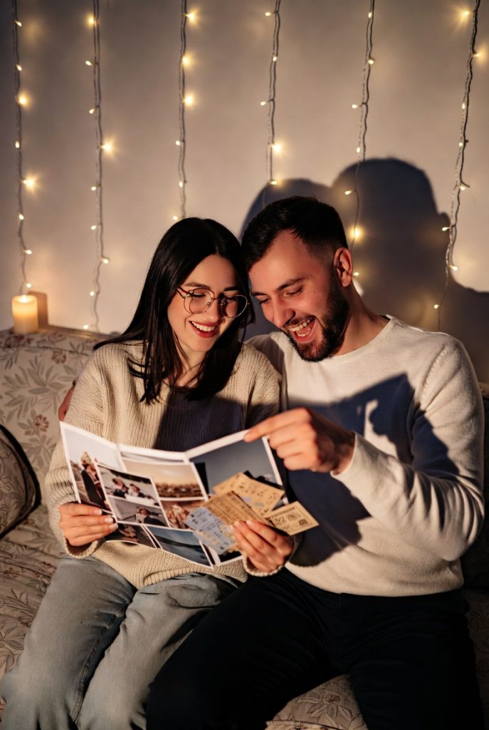 Couple enjoying a memory lane evening as a meaningful no money gift for girlfriend